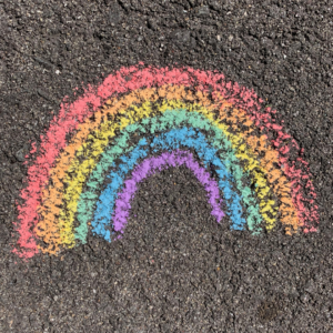 NHS rainbow on pavement